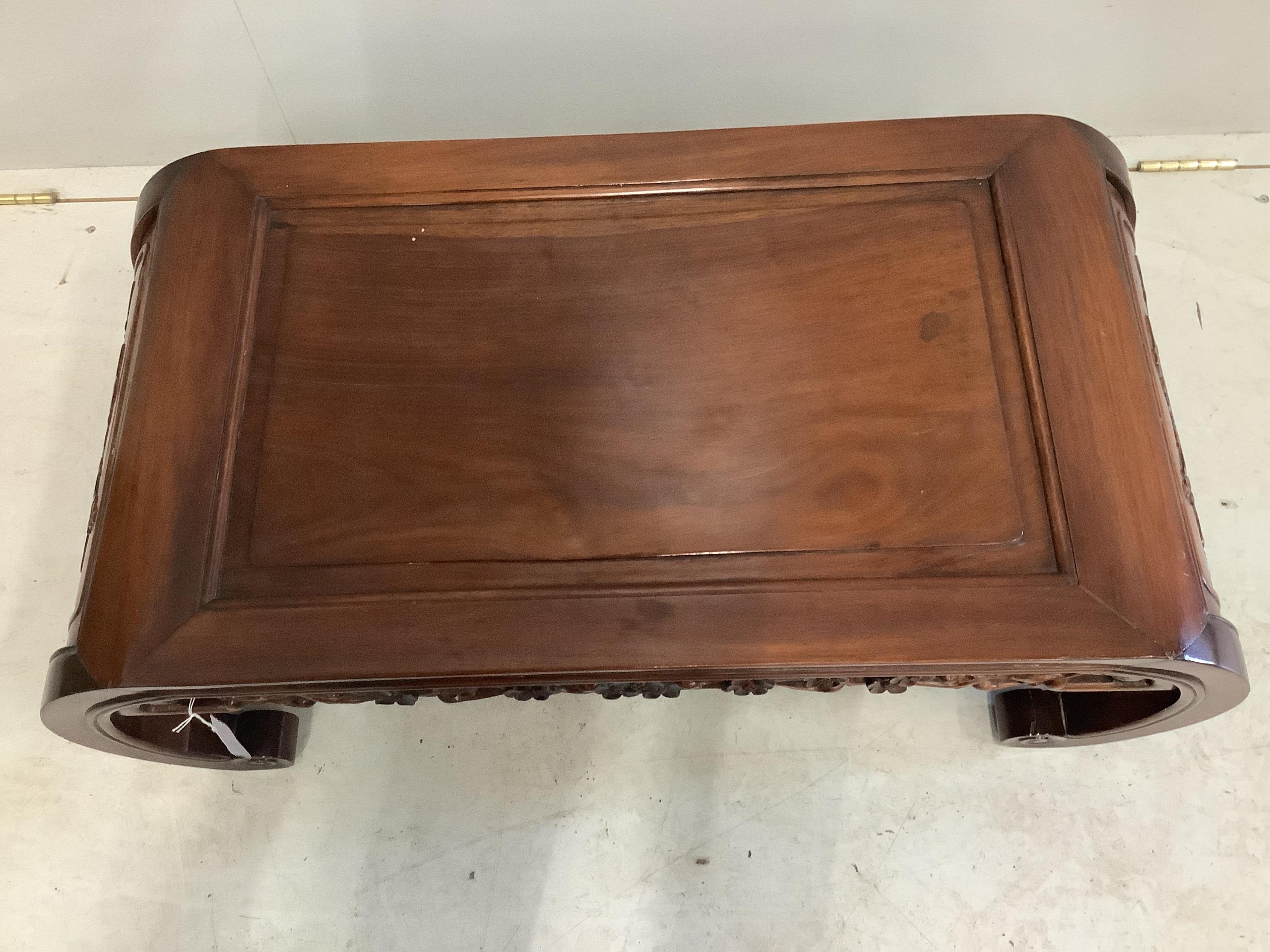 An early 20th century Chinese hardwood opium table, width 88cm, depth 46cm, height 33cm. Condition good.